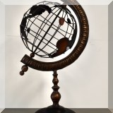 D11. Metal globe décor.